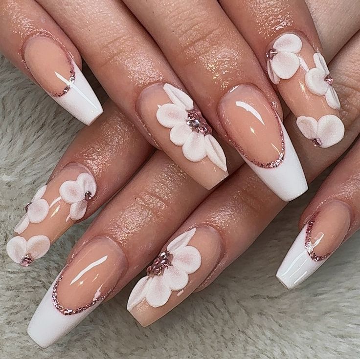 Elegant Floral Nail Design with 3D Flowers and Sparkling Accents.