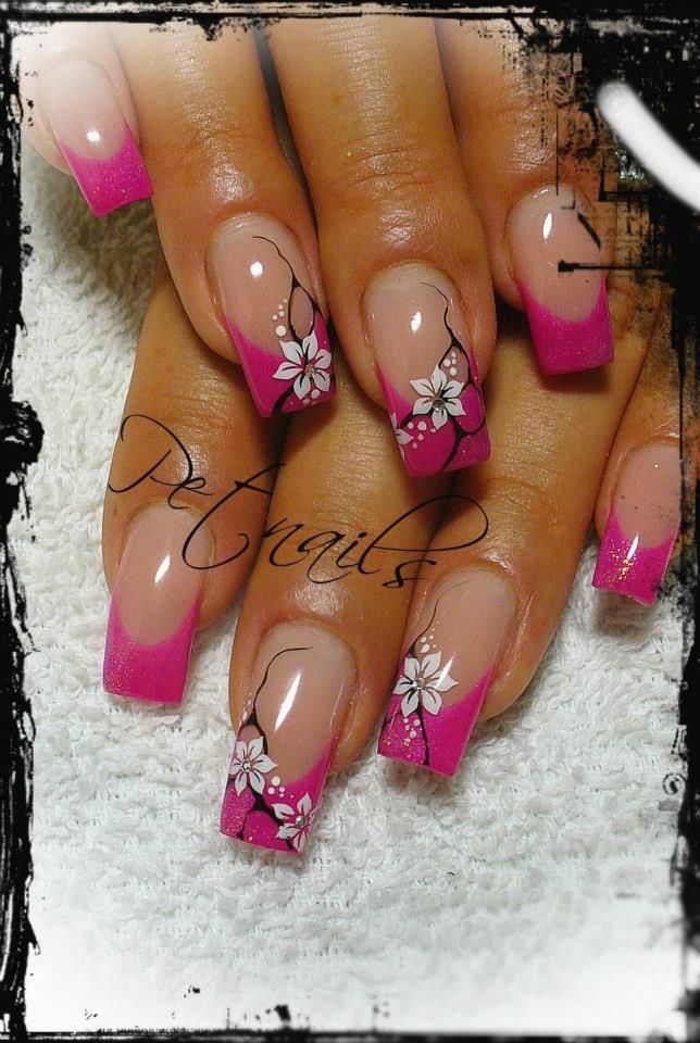 Exquisite Pink French Tip Nail Design with Delicate Floral Patterns for Elegant Occasions.