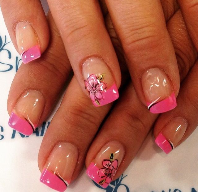 Sophisticated Floral Pink French Manicure with Gold Accents on Nude Base