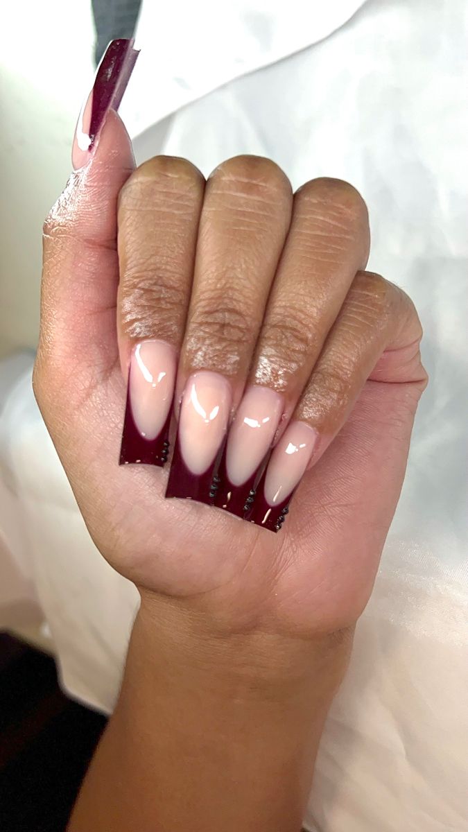 Sophisticated Ombre Nail Design in Deep Burgundy and Soft Nude.