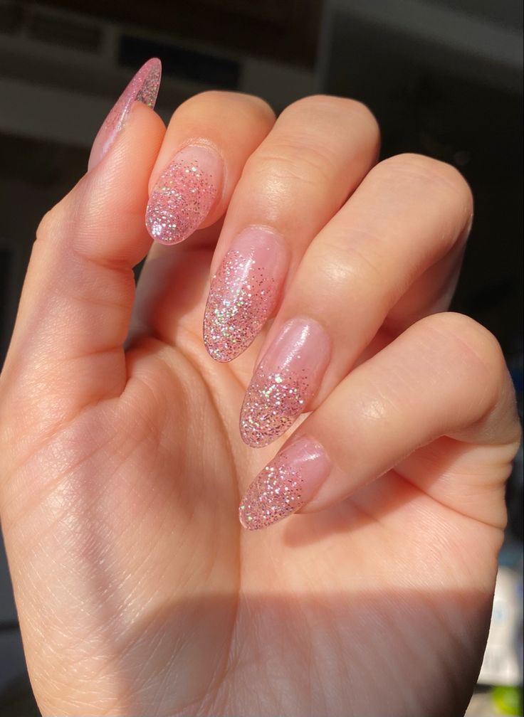 Glamorous Sparkling Pink Ombre Nail Design with Glitter Accents