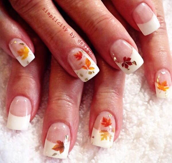 Autumn-Inspired French Tip Nails with Leaf Designs Celebrate Seasonal Elegance.