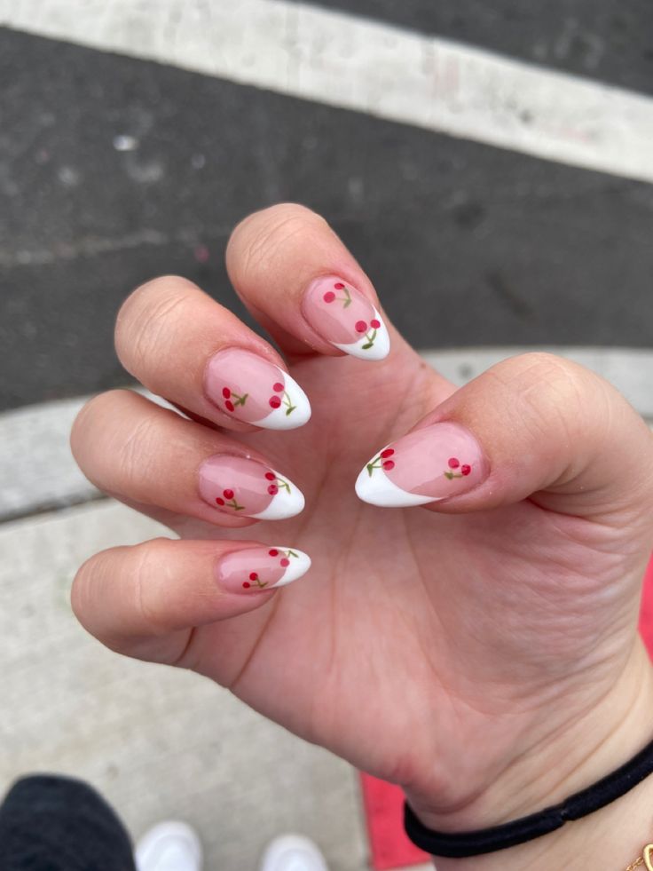 Elegant French Manicure with Playful Cherry Blossom Accents.