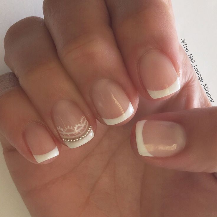 Sophisticated French Manicure with Lace and Rhinestone Detailing for Special Occasions.