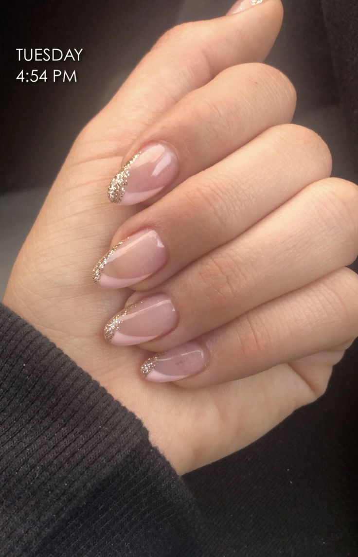 Elegant Nude Manicure with Delicate French Tips and Gold Accents.