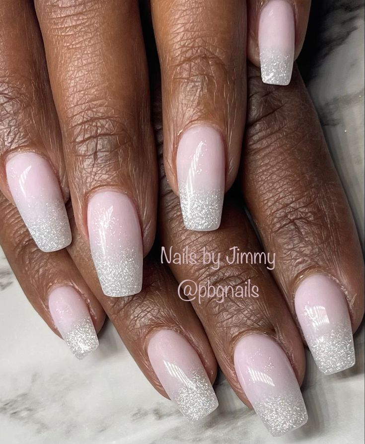 Elegant Ombre Nail Design: Soft Pink to Sparkling White Gradient with Subtle Shimmer.