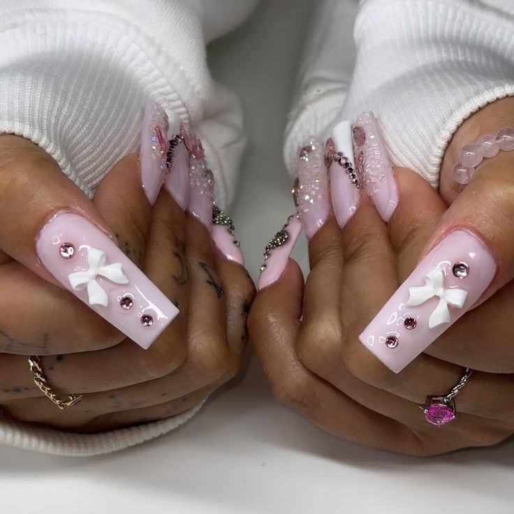 Chic Pink Nail Design with Elegant Embellishments and Sparkling Accents