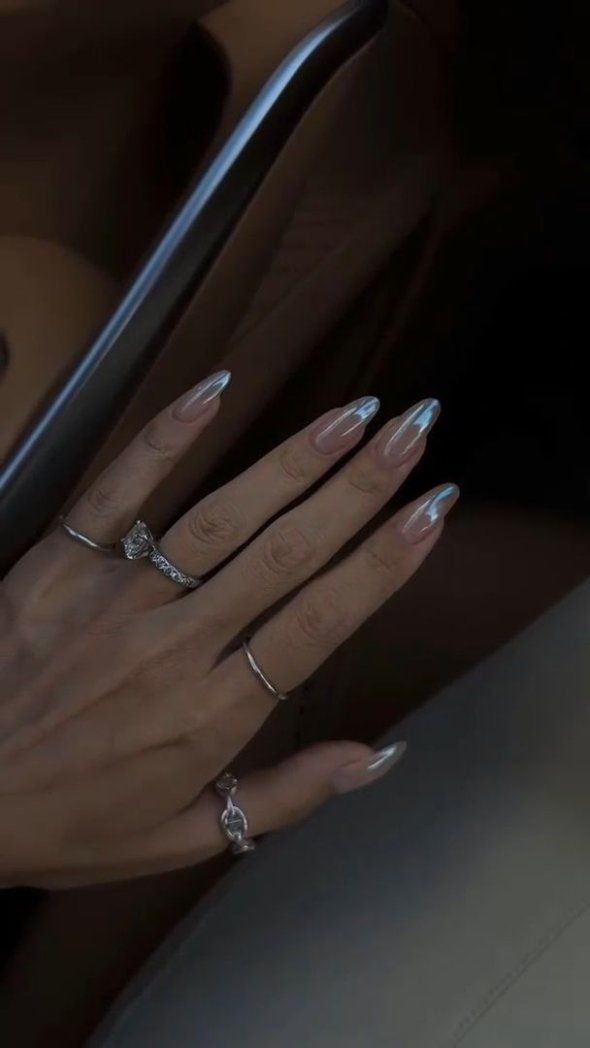 Sophisticated Almond-Shaped Nail Design with Nude Base and Striking Silver Accents