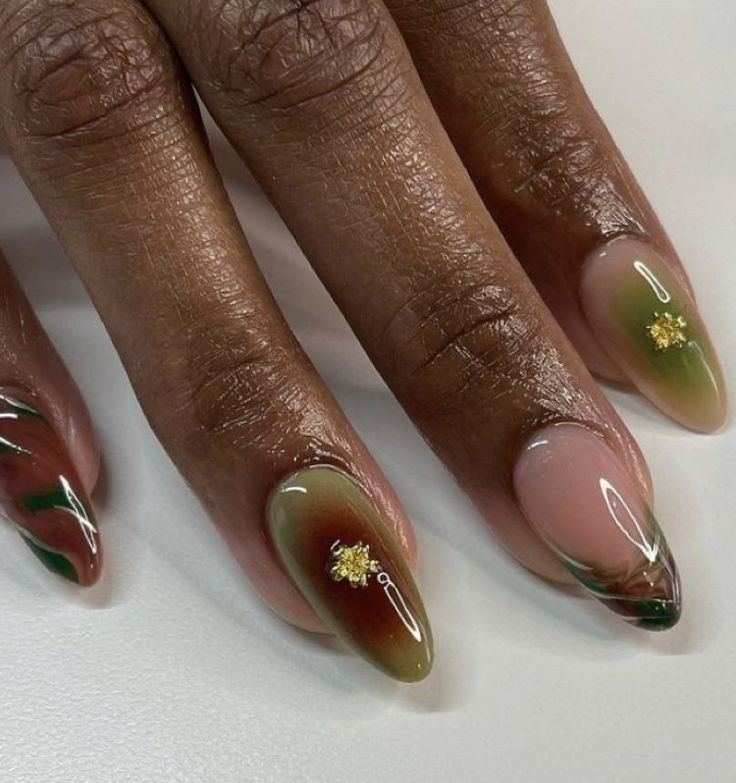 Sophisticated Earthy Tone Nail Design with Gradient Effects and Gold Accents.