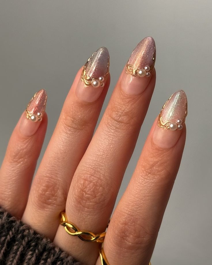 Chic Stiletto Nail Design with Gradient Pink to Lilac Effects and Gold Accents