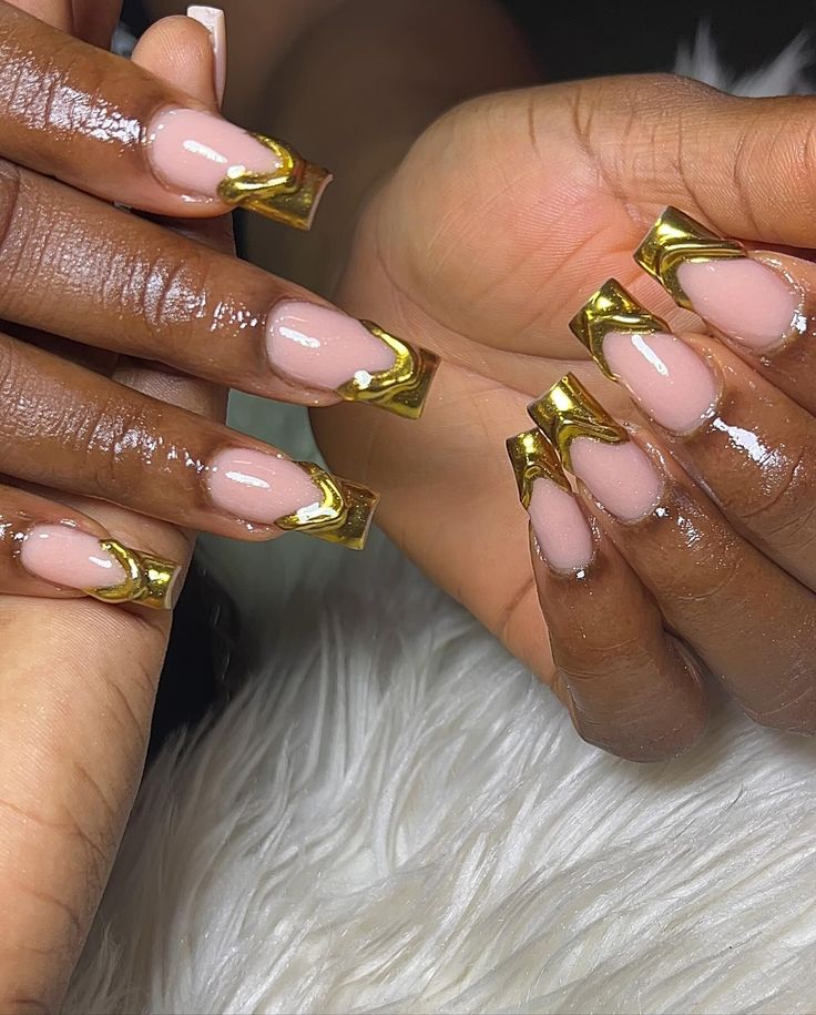 Chic Nude and Metallic Gold Nail Design with Glossy Finish.