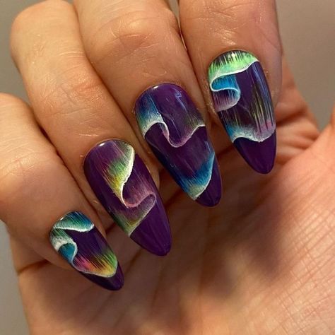 Eye-Catching Vibrant Purple Nail Design with Flowing Color Waves.