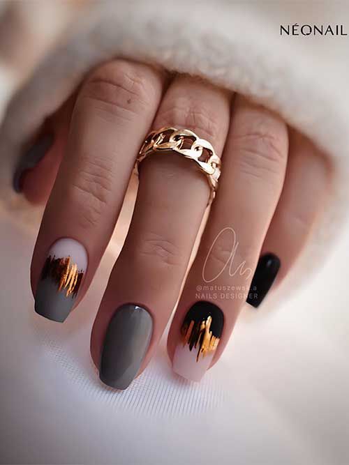 Chic Elegant Nail Design: Neutral Tones with Bold Black and Metallic Accents