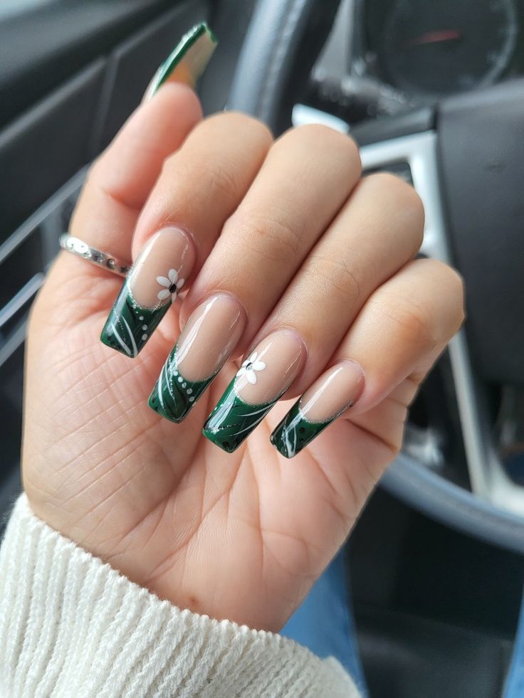 Sophisticated Half-Moon Green Nail Design with Delicate White Flowers.