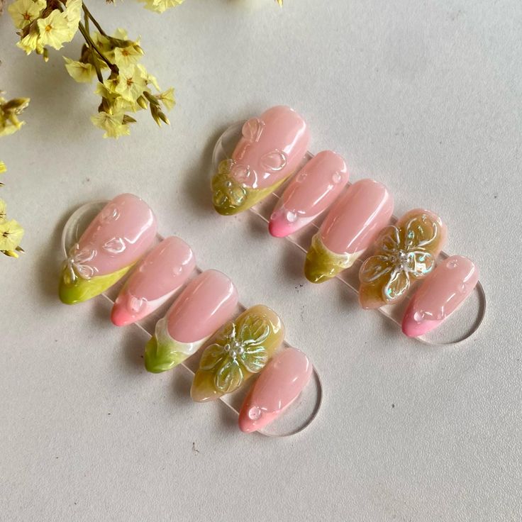 Elegant Soft Pink and Green Floral Nail Design for Any Occasion.