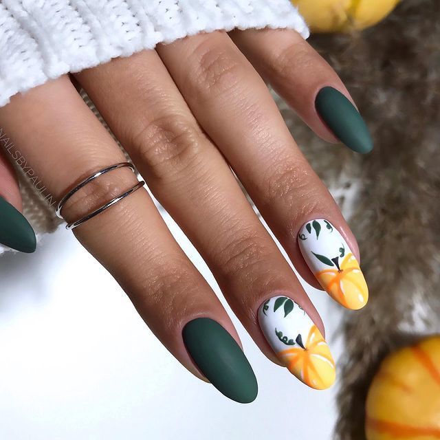 Chic Matte Dark Green Nails with Vibrant Floral Accents.