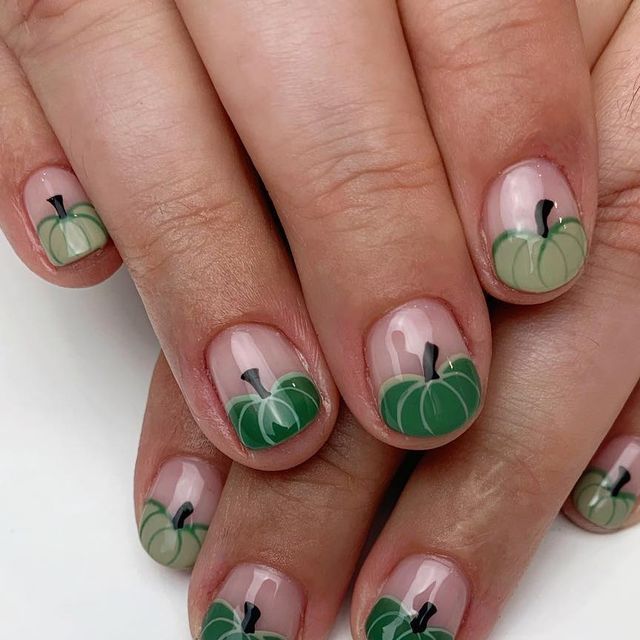 Charming Pumpkin-Themed Nail Design Capturing Autumn Style.