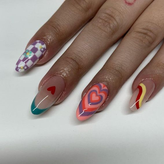 Playful and Vibrant Nail Design: A Whimsical Mix of Patterns and Colors.