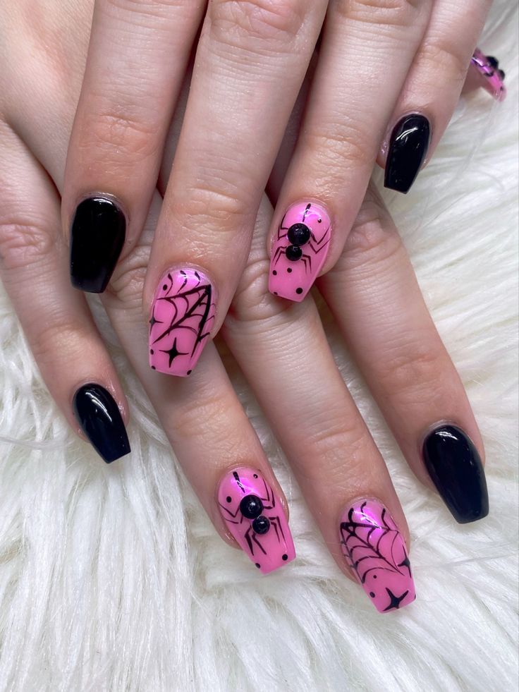 Bold Pink and Black Spider-Themed Nail Design with Intricate Web Patterns.