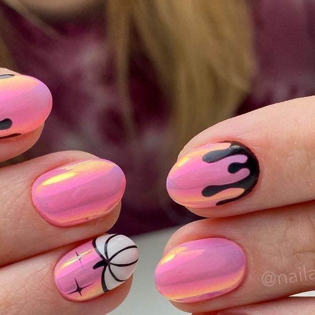 Vibrant Gradient Pink Nail Design with Playful Black Drips and Delicate White Spider Web Detail.