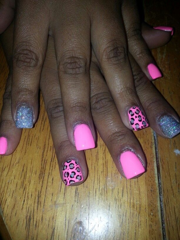 Trendy Vibrant Nail Design with Bright Pink, Sparkling Silver, and Playful Leopard Print Accents