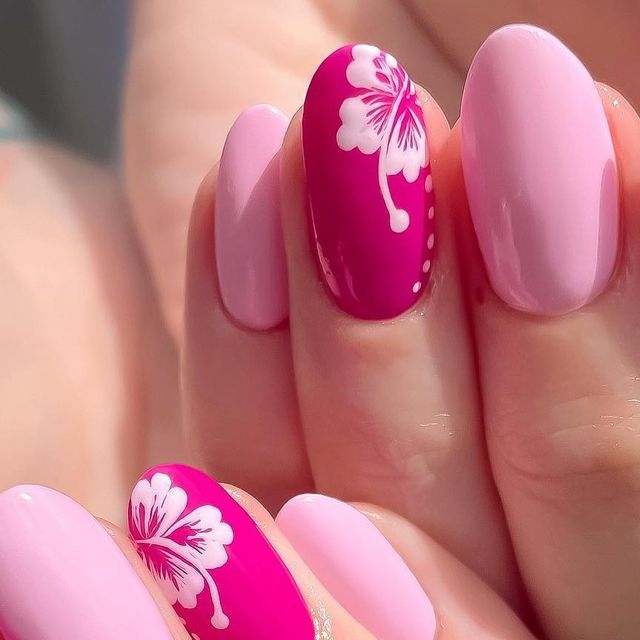 Vibrant Pink and Pastel Nail Design with Elegant Floral Accents for Spring and Summer.