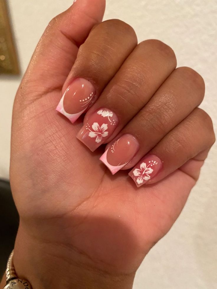 Chic Floral-Themed Nail Design with Soft Pink and Elegant White Accents.