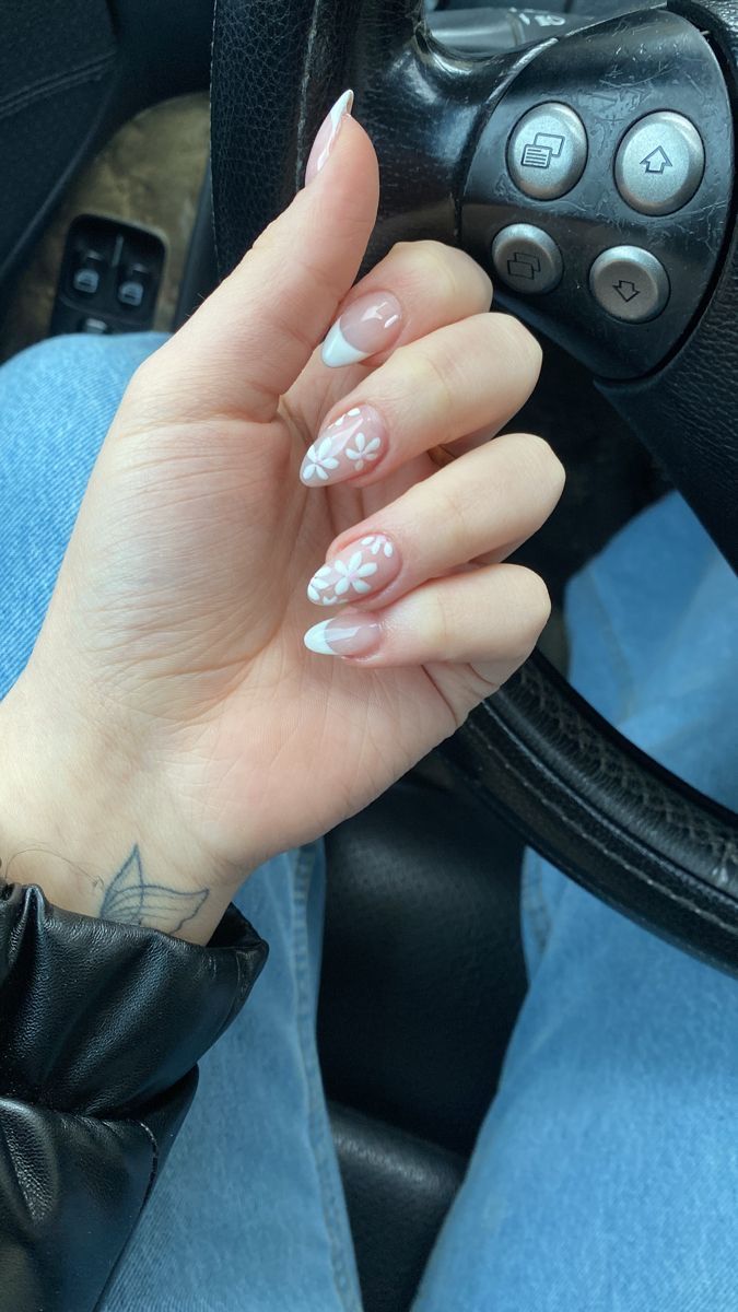 Elegant French Tip Nail Design with Delicate Floral Accents