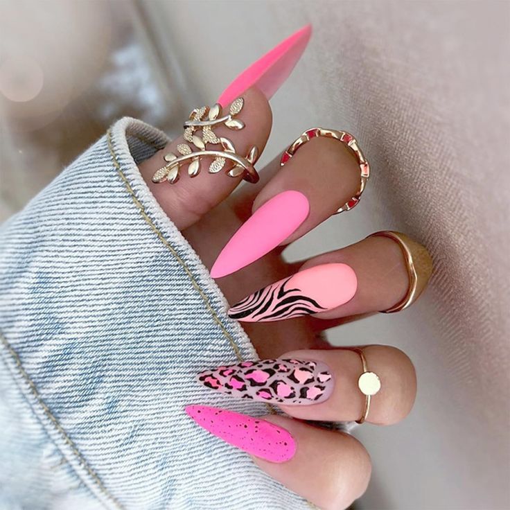 Vibrant Pink Animal Print Stiletto Nail Design with Glossy and Matte Finishes.