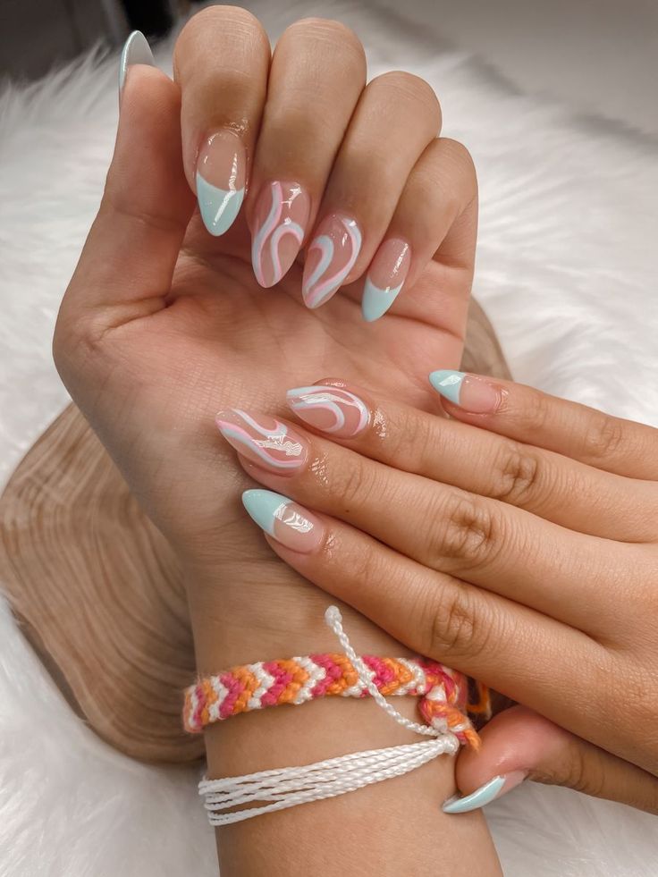 Playful Pastel Almond Nail Design with Abstract Patterns and Glossy Finish.