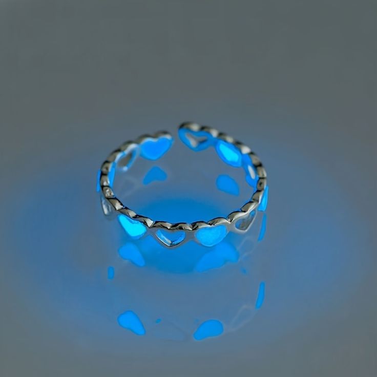 Charming Heart-Shaped Silver Ring with Blue Accents for a Romantic and Whimsical Statement.