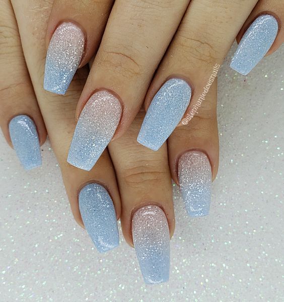 Elegant Gradient Glitter Nails in Soft Blue Shades for Chic Style.