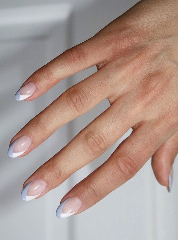 Sophisticated Almond-Shaped Nail Design: Soft Nude Base with Crisp White Tips.