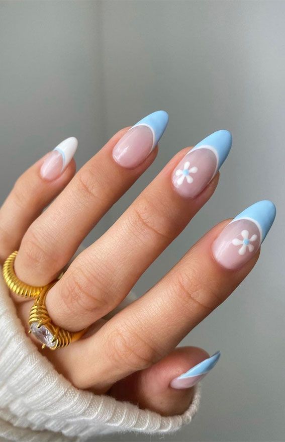 Chic Pastel Nail Design with Floral Accents for Elegant Playfulness.