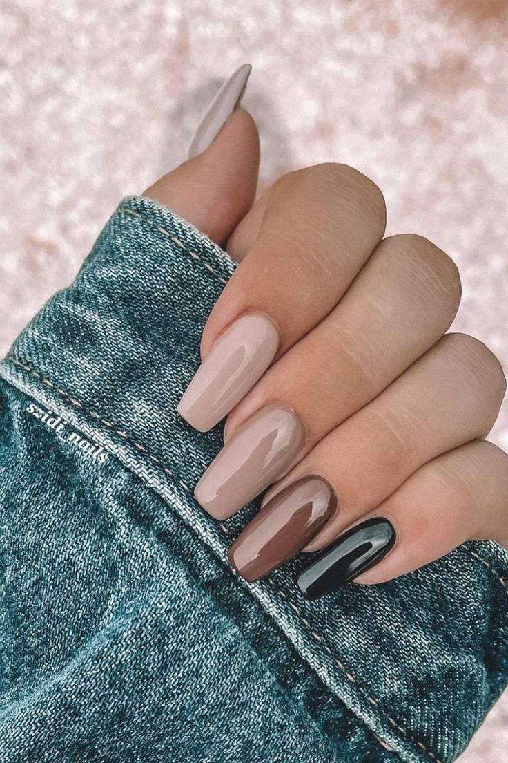 Chic Nail Design: A Harmonious Blend of Soft Pink, Warm Taupe, and Striking Black Accents.