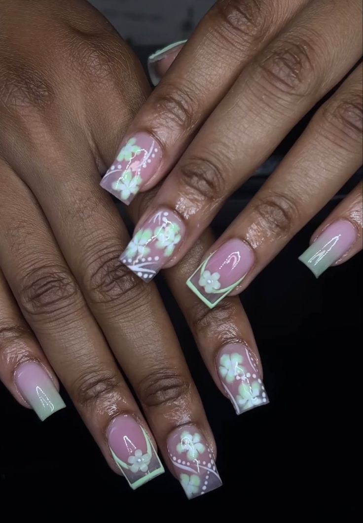 Elegant Floral Nail Design with Pastel Hues and Intricate Detailing