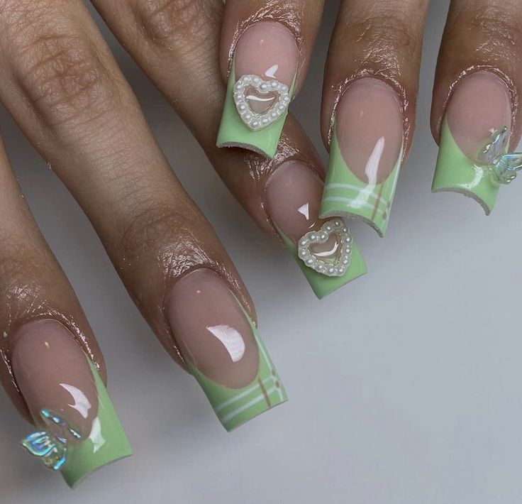 Whimsical Nail Design: Soft Green Palette with 3D Heart and Butterfly Accents