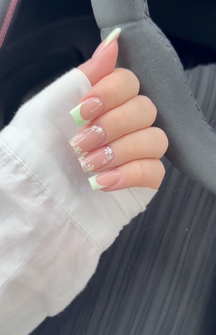 Charming Pastel Floral Nail Design with Soft Pink Base and Playful Green Tips