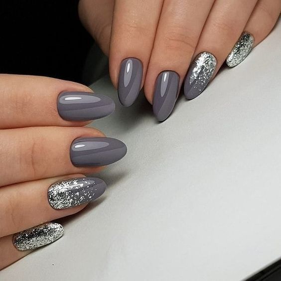 Sophisticated Sleek Gray Manicure with Shimmering Silver Accents for Elegance.