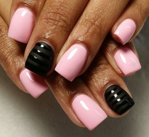 Elegant Chic Nail Design: Soft Pink Base with Glossy Black Accents and Bold Stripes