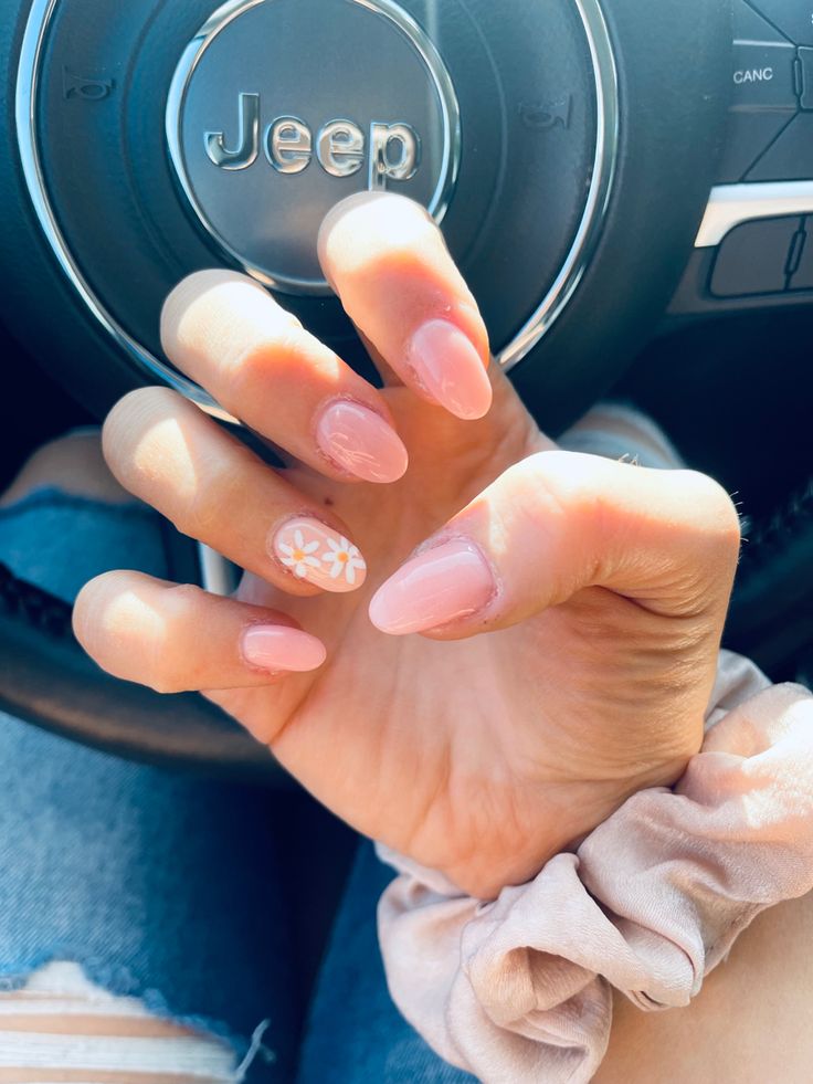 Chic Soft Pink Nail Design with Floral Accent for Any Occasion