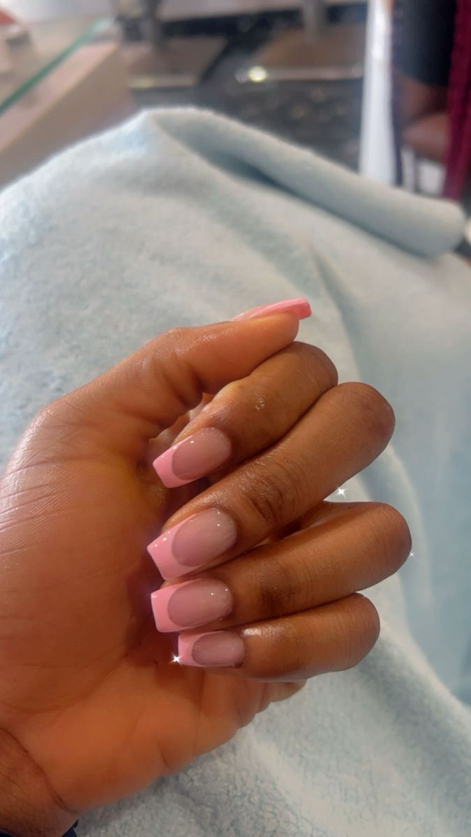 Sophisticated Pink and Nude Gradient French Tip Nail Design.