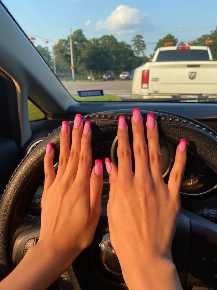 Eye-Catching Gradient Pink Nail Design: A Chic Touch for a Stylish Lifestyle in Car Interiors.