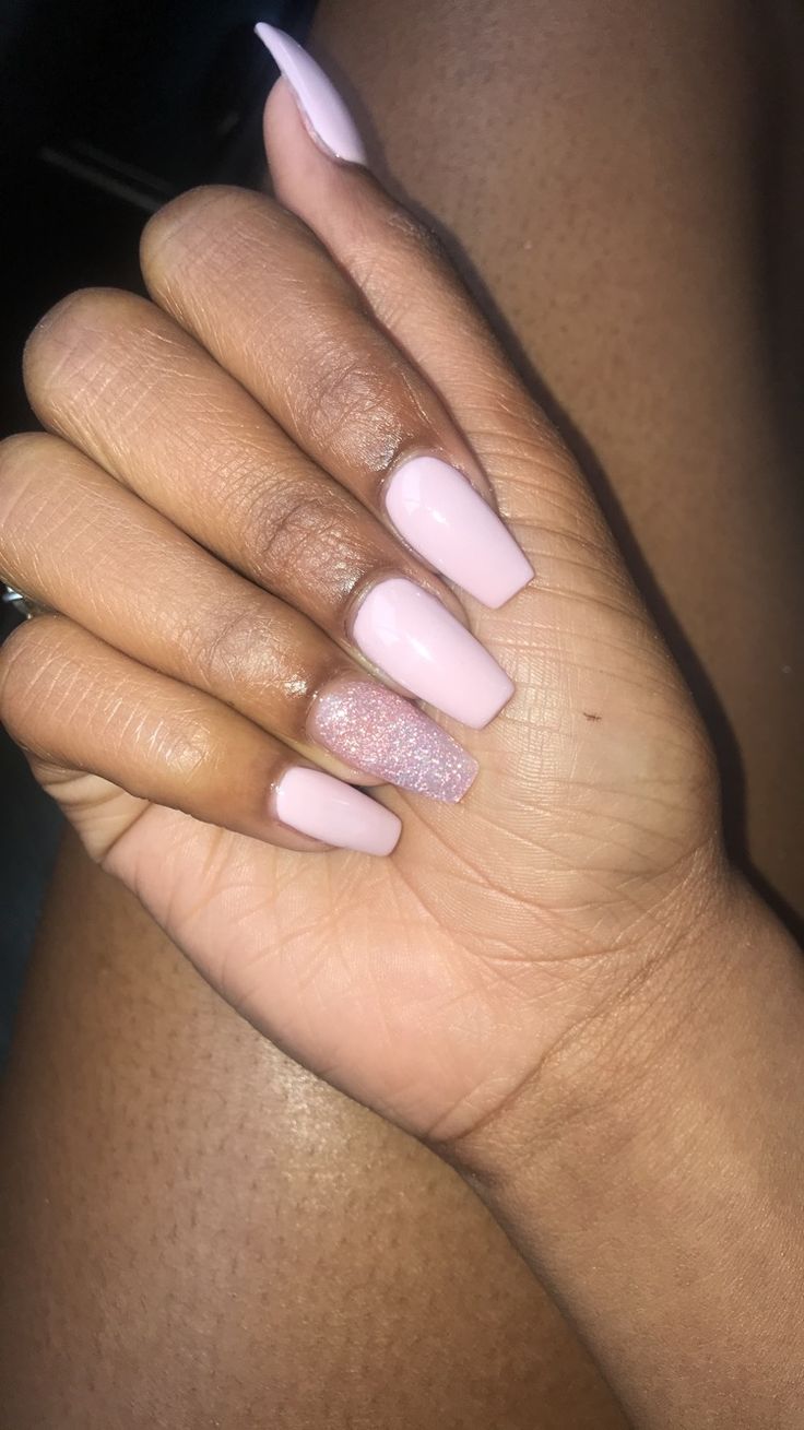 Elegant Soft Pink Nail Design with Glitter Accent for a Stylish Touch.