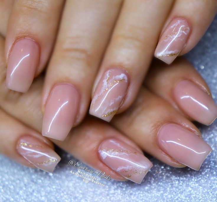 Sophisticated Elegant Nude Nails with Marble Designs and Luxurious Gold Accents