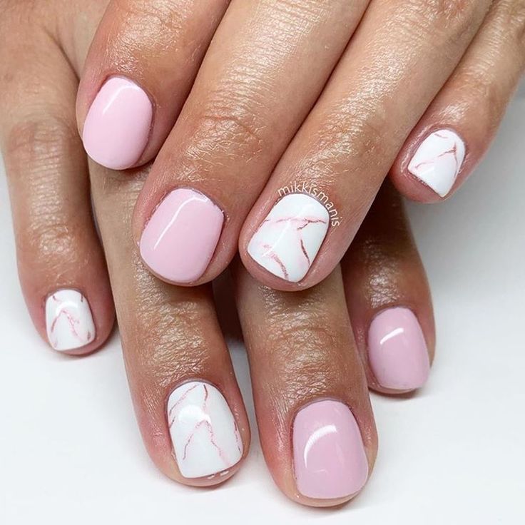 Elegant Marble-Designed Soft Pink Nails: A Sophisticated Manicure for Any Occasion.