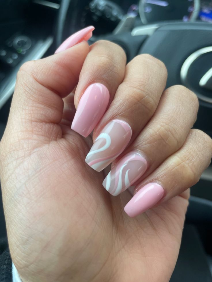 Sophisticated Pink Nails with Elegant Swirls and Chic Shape.