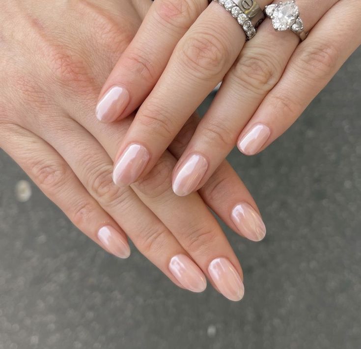 Chic Almond-Shaped Nails with Glossy Nude Polish for Timeless Sophistication.