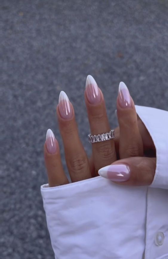 Chic Almond-Shaped Nails: Soft Pink Gradient with Glossy White Tips and Sparkling Accents