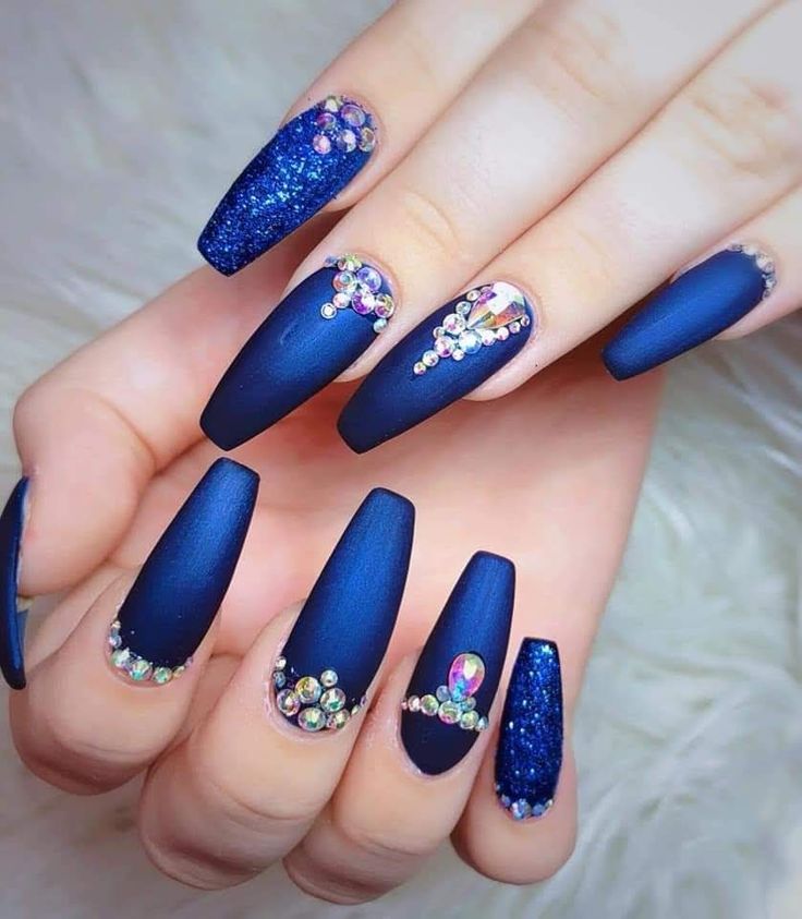 Elegant Navy Blue Matte Nail Design with Sparkling Accents and Gem Details